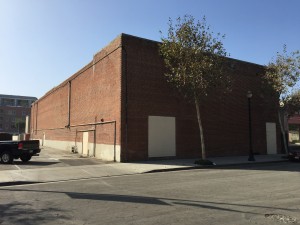 The brick walls of the Avenue Theatre along Third Street, east of Downey Ave.